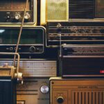 a bunch of old radio's are stacked on top of each other