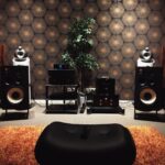 black and silver speakers on white table