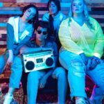 Retro Style Portrait of a Group of Young People with a Boombox