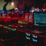Black Laptop Beside Audio Mixer Set