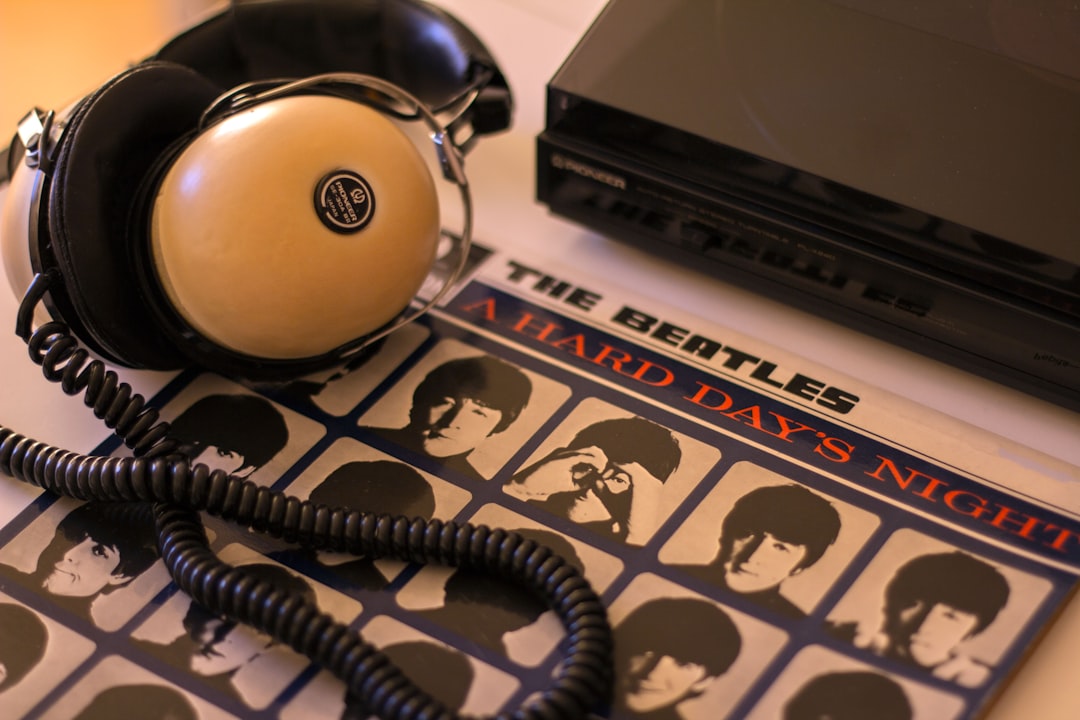 Headphones and a beatles album ready for listening.