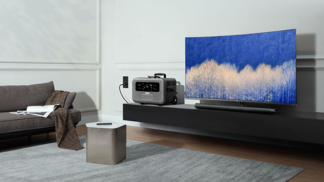 a flat screen tv sitting on top of a wooden table