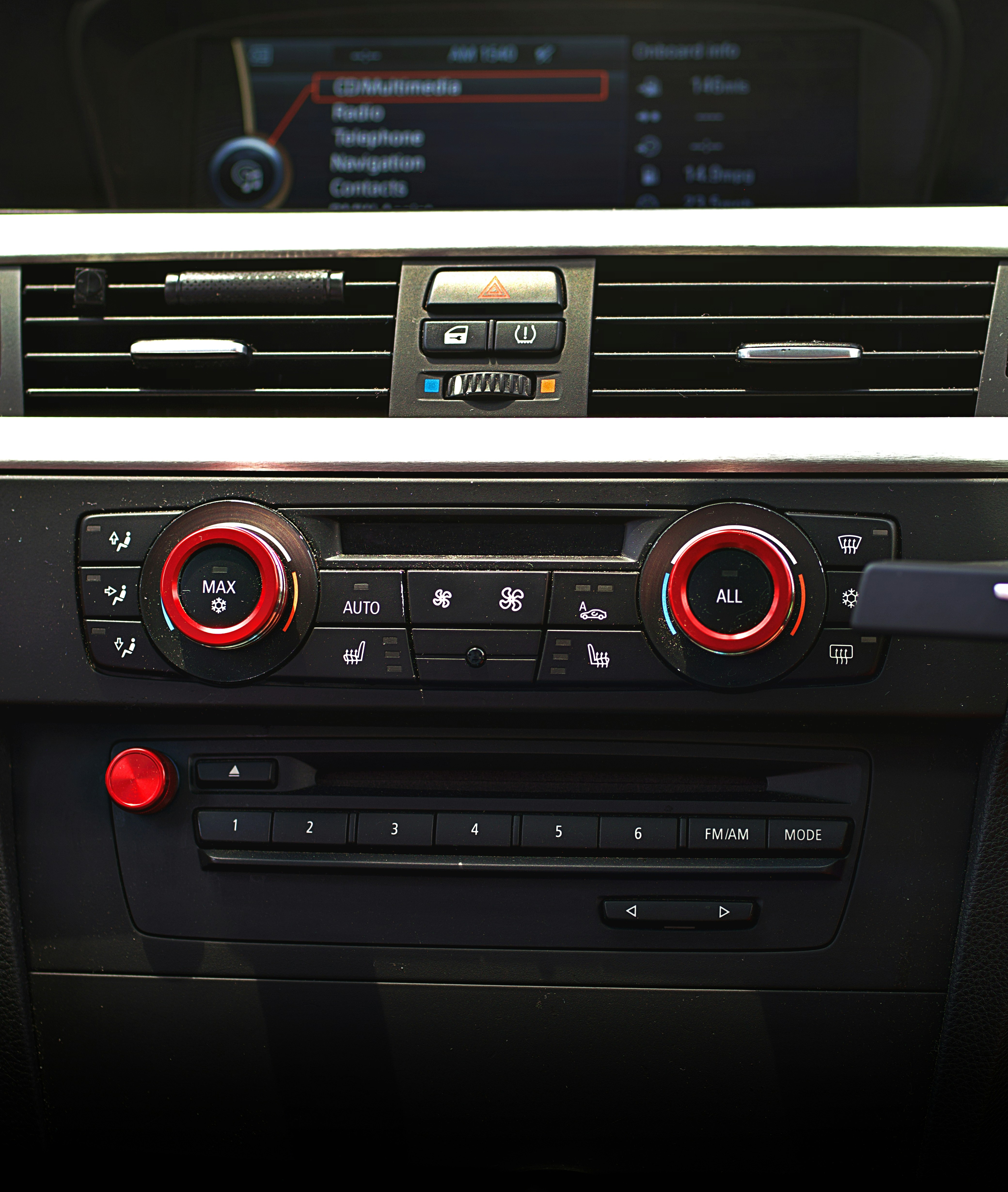 Car's dashboard with various controls displayed.